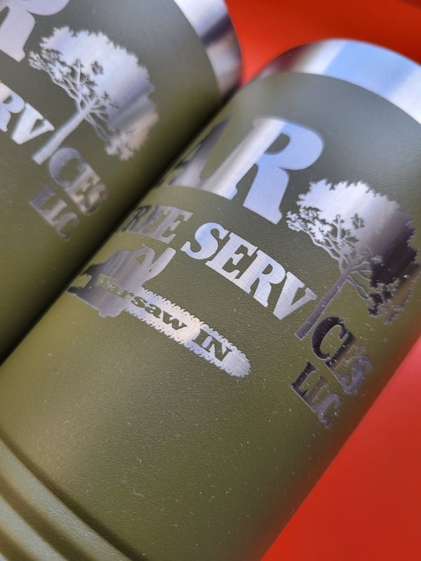 Olive-green insulated tumblers engraved through the coating to bare steel with the AR Tree Services logo and Warsaw, IN.