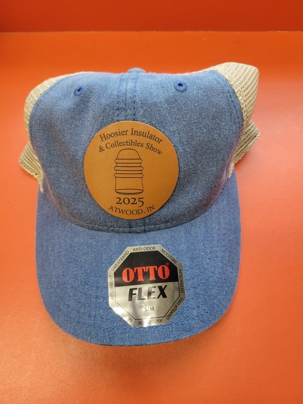 A denim cap with a leather patch engraved for the 2025 Hoosier Insulator and Collectibles Show, Atwood, IN.