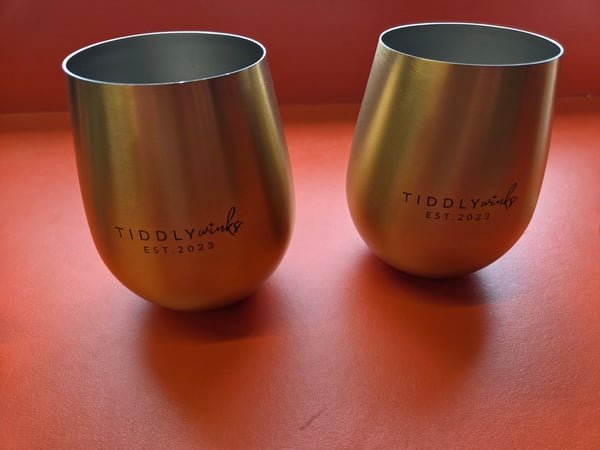 Two stainless steel stemless wine cups engraved Tiddlywinks, Est. 2020.