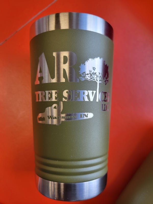 An olive tumbler engraved with the AR Tree Services logo, chainsaw and Warsaw, IN.