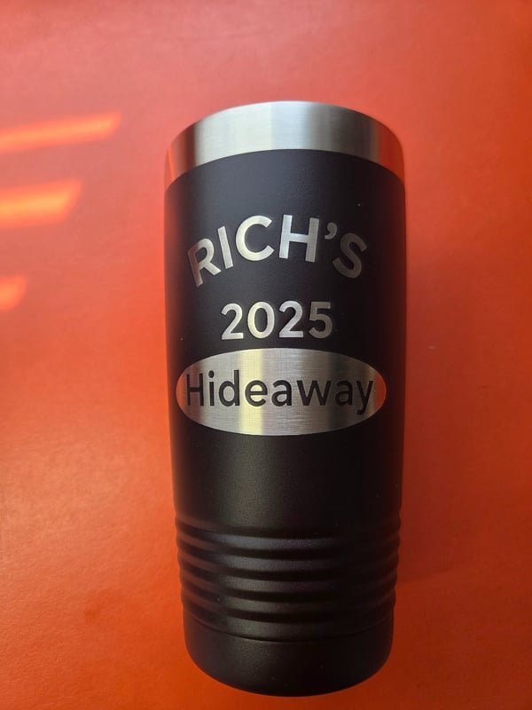 A black tumbler engraved Rich's 2025 Hideaway.