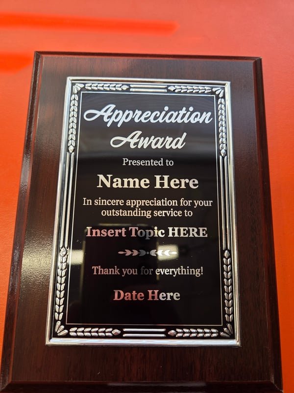 A wood-mounted plaque with a decorative border, engraved as an Appreciation Award template.