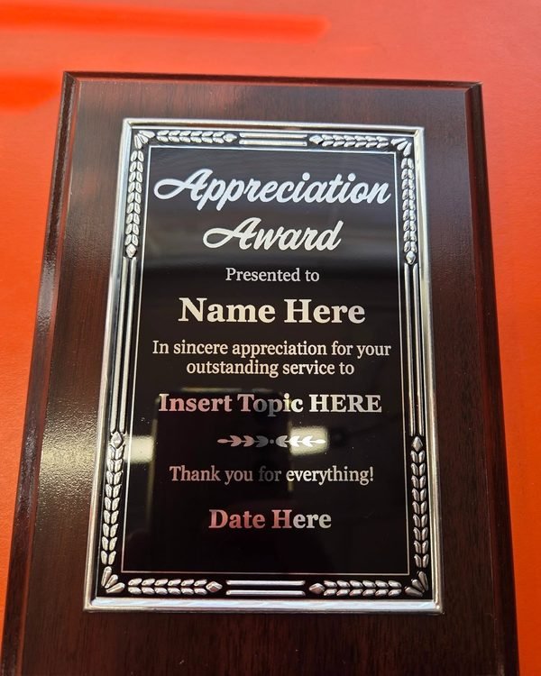 A wood-mounted plaque with a silver decorative border, engraved as an Appreciation Award template.
