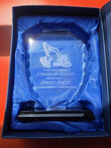 The Talley Lambert Construction service award seated in its blue satin presentation box.