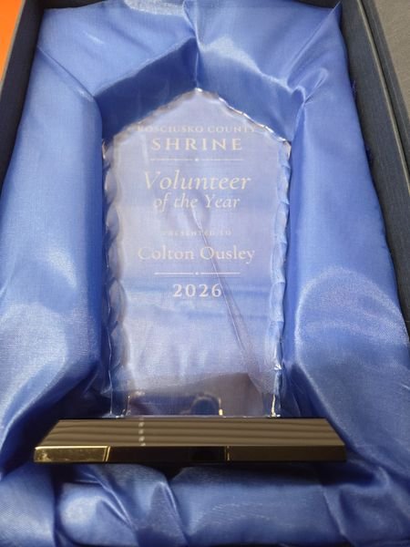The Kosciusko County Shrine Volunteer of the Year award nested in its blue satin presentation box.